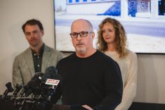 Man speaking at a podium