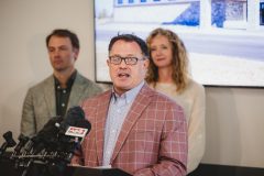 Man speaking into podium