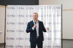 Man speaks into microphone