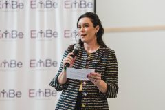 Woman speaking into microphone