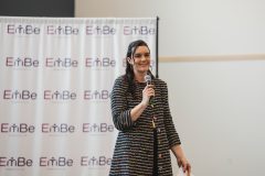 Woman speaking into microphone
