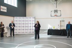 Woman speaks into microphone