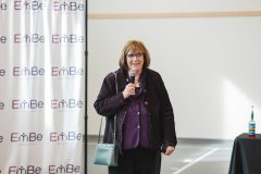 Woman speaking into microphone