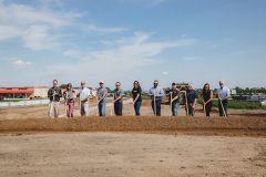 Troy and Kristin Fox joined by project officials and community leaders