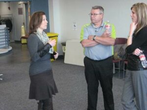 From left to right: Gina Cooper from Lake Crystal discusses the load management program with Heartland Customer Relations Manager Steve Moses and Communications Manager Ann Hyland.