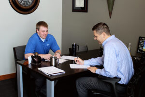 Riley Bullington, left, worked with Director of Economic Development Ryan Brown, right, on the customer research project in 2015.