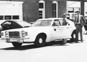 Kathie, former employe Matthew O'Laughlin and the Heartland vehicle in 1978.