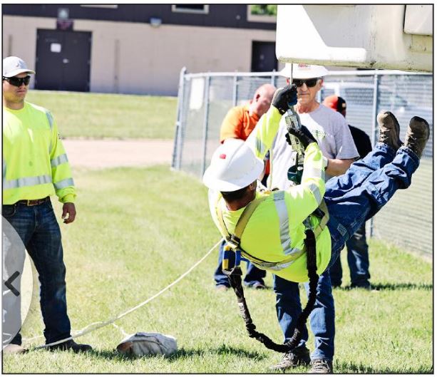 power-linemen going through a training program