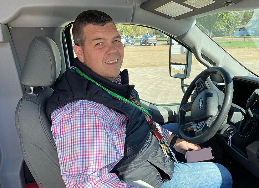 MHS Principal and Madison City Commissioner Adam Shaw driving a car