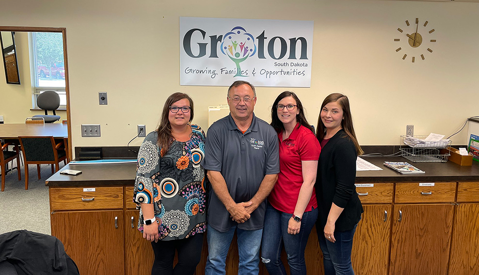 group of groton officials standing in their workspace