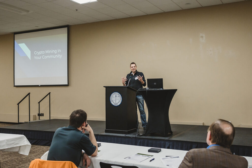 Man standing behind a podium speaking