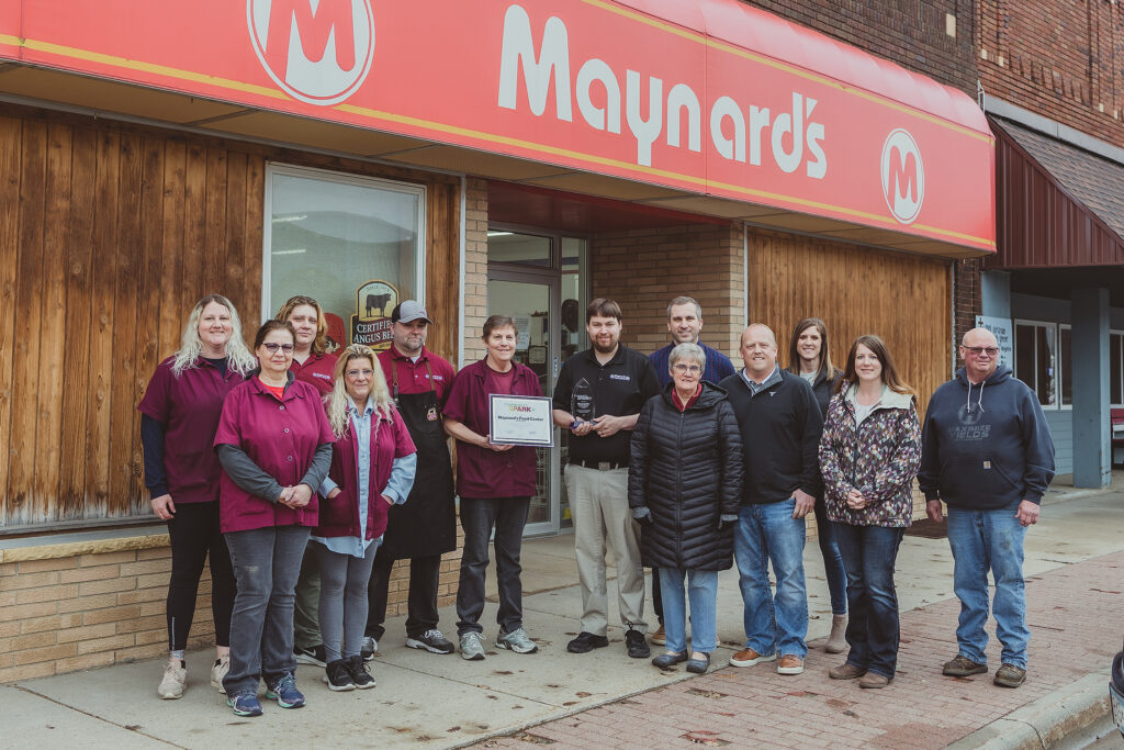 Employee's standing in front of Maynard's Food Center