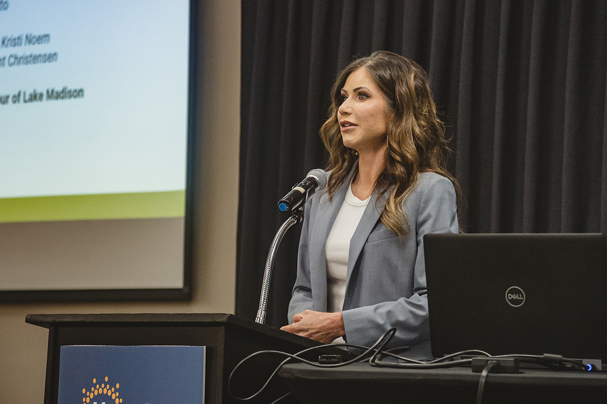 Kristi Noem speaks at podium