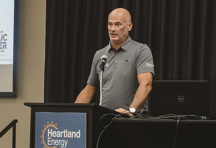 Heartland Energy CEO Russell Olson speaks at podium