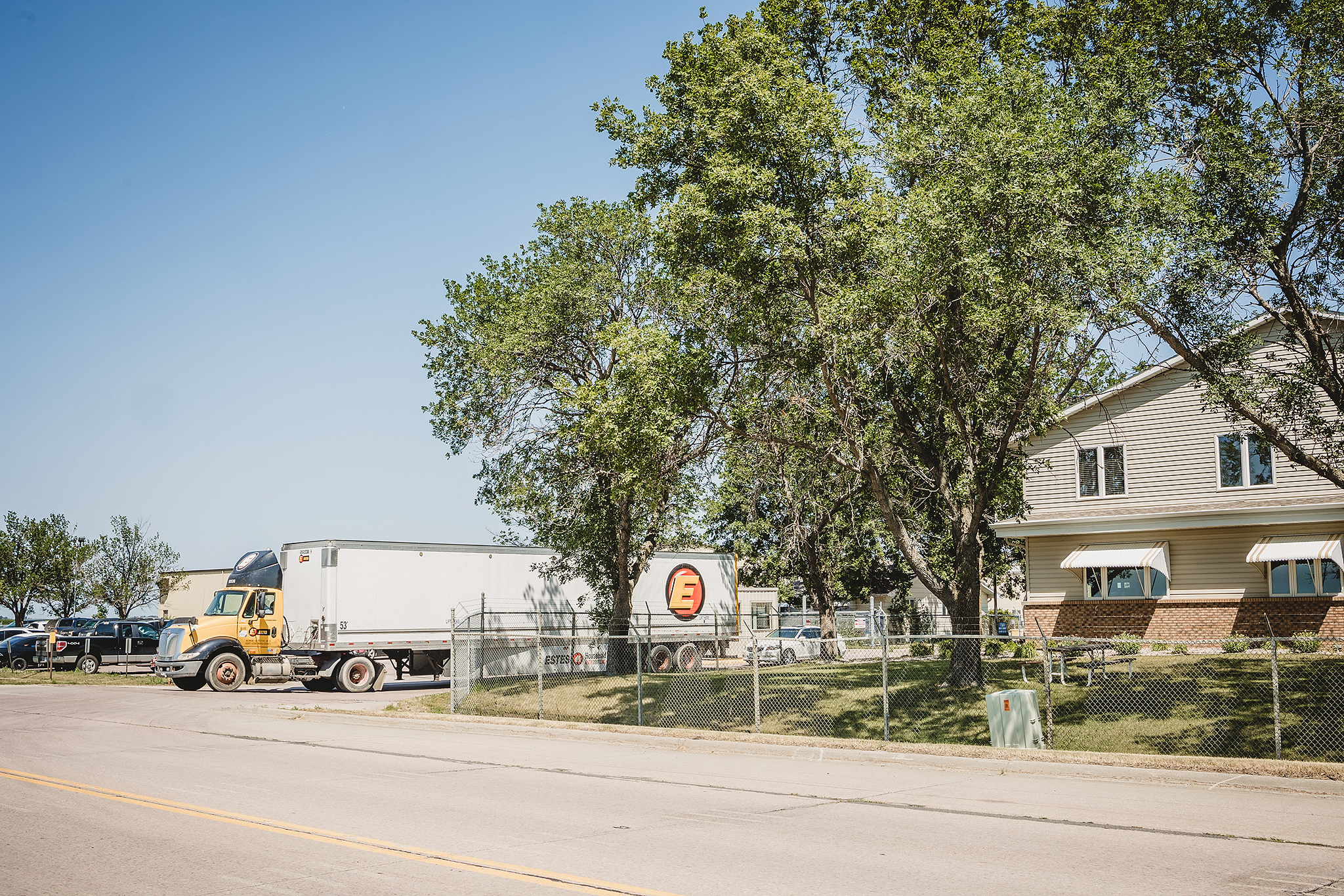 Semi-truck exits T&R parking lot onto highway